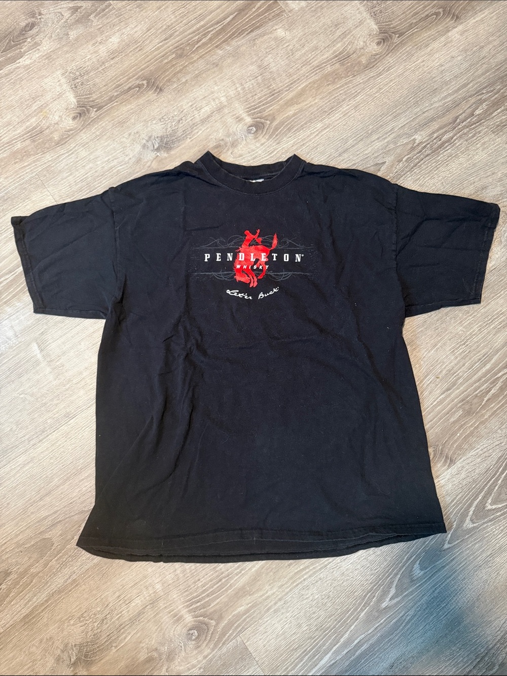 100% Preshrunk Cotton Black Short Sleeve Tee with Red Pendleton Logo